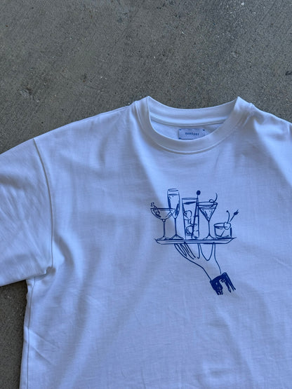 Hang Dry Gallery White Sunday Dinner tee — front view of the hand and cocktail tray graphic on a premium cotton tee