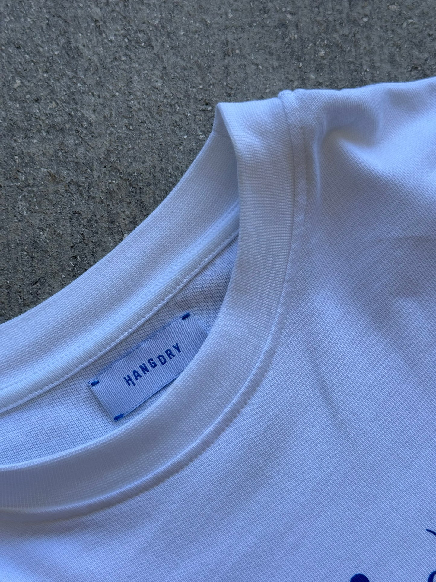 Hang Dry Gallery White Sunday Dinner tee interior label — brand identity and garment details
