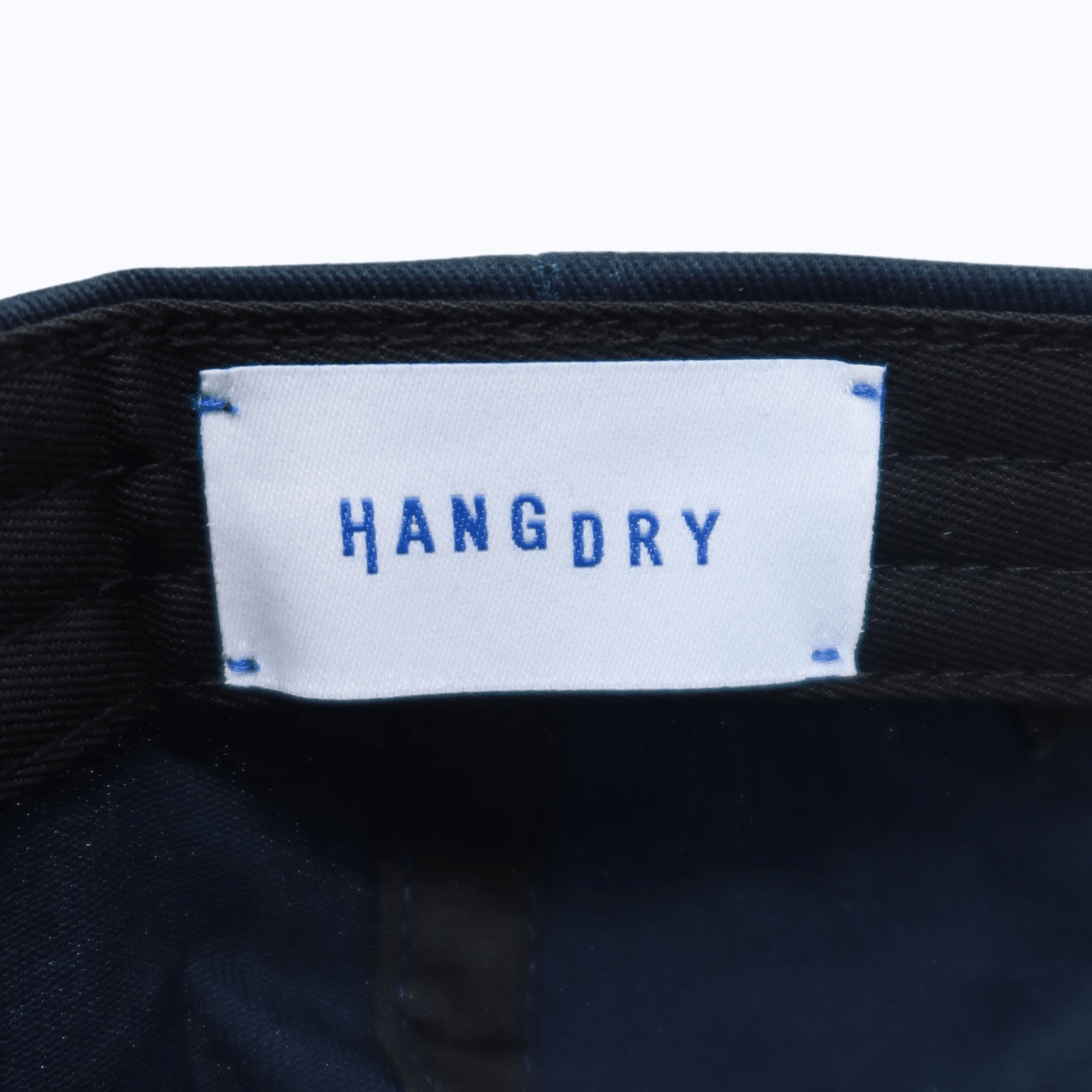 Hang Dry ballcap branded interior label — clean branding detail and quality craftsmanship