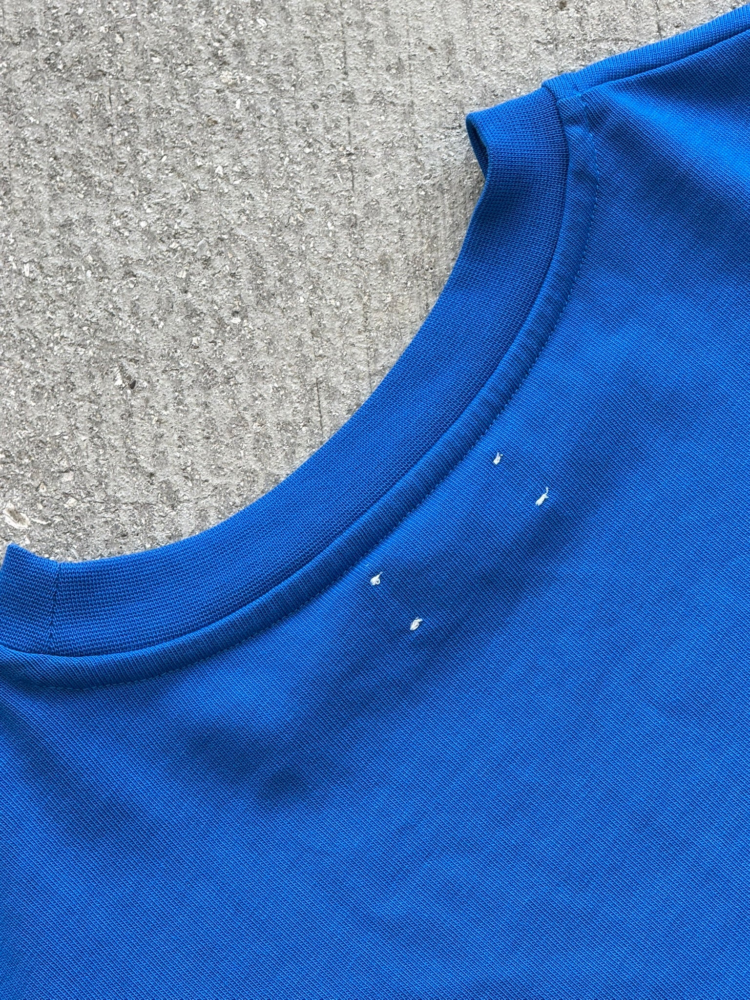 Hang Dry Studio Blue Sunday Dinner tee — detail shot of the graphic and fabric texture