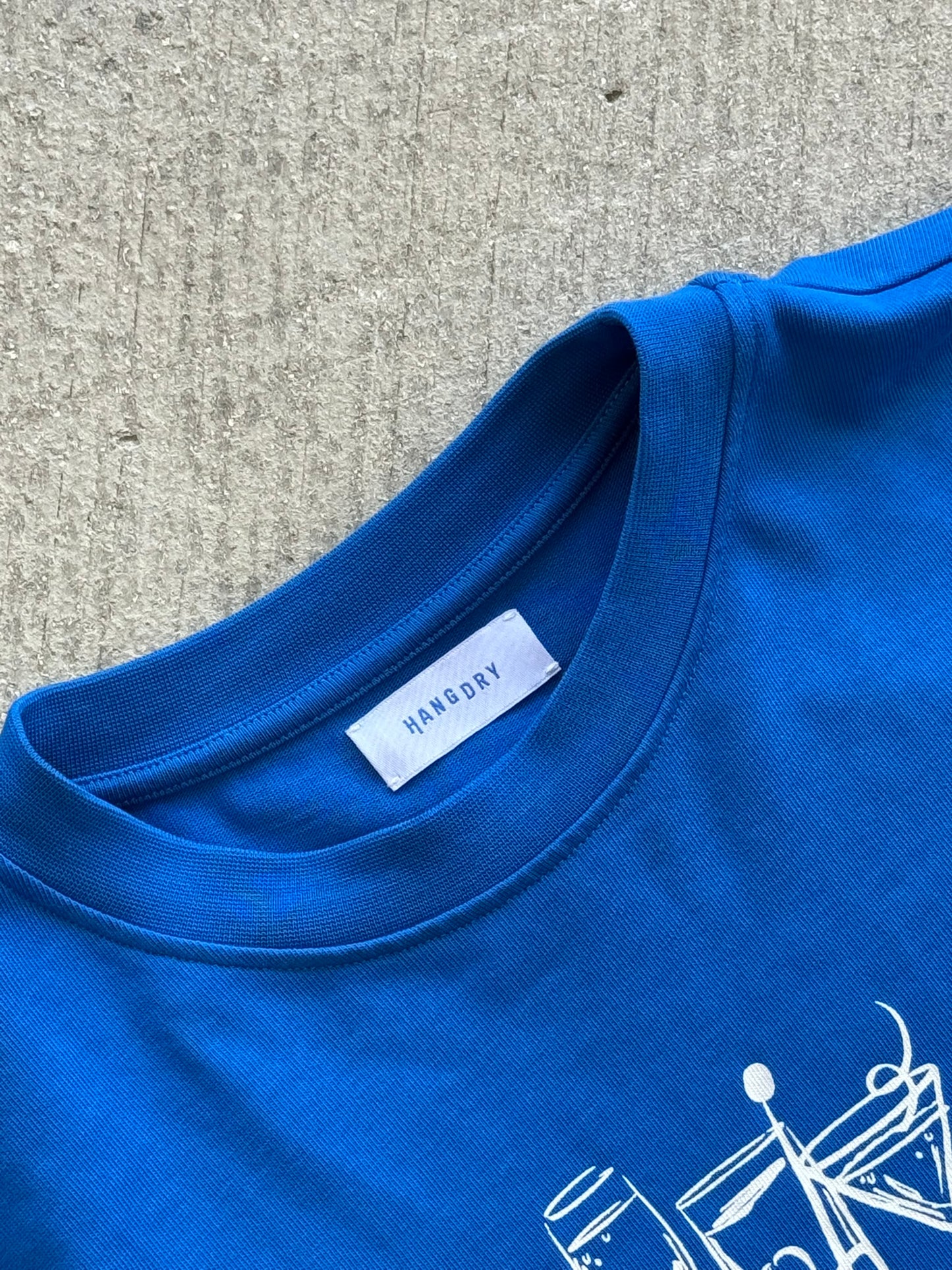 Hang Dry Studio Blue Sunday Dinner tee interior label — garment details and brand identity