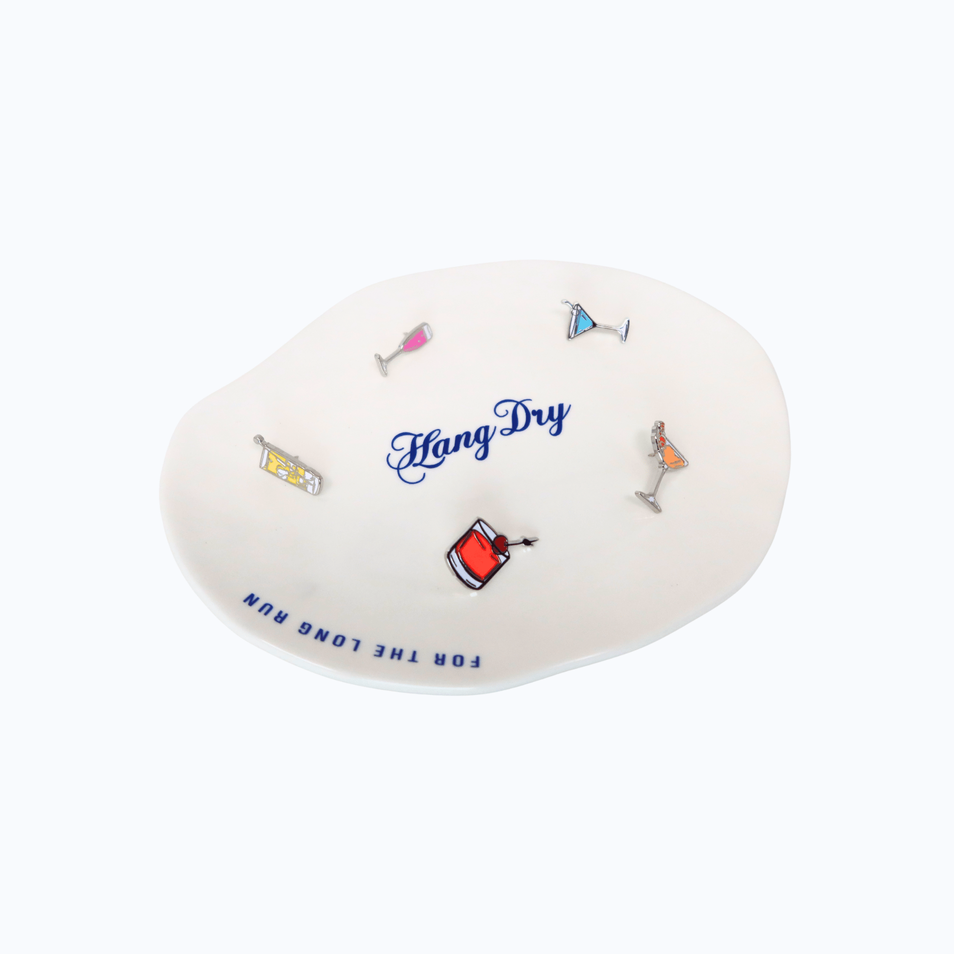 Hang Dry Sunday Dinner Luncheon Plate styled with assorted enamel pins on organic white ceramic
