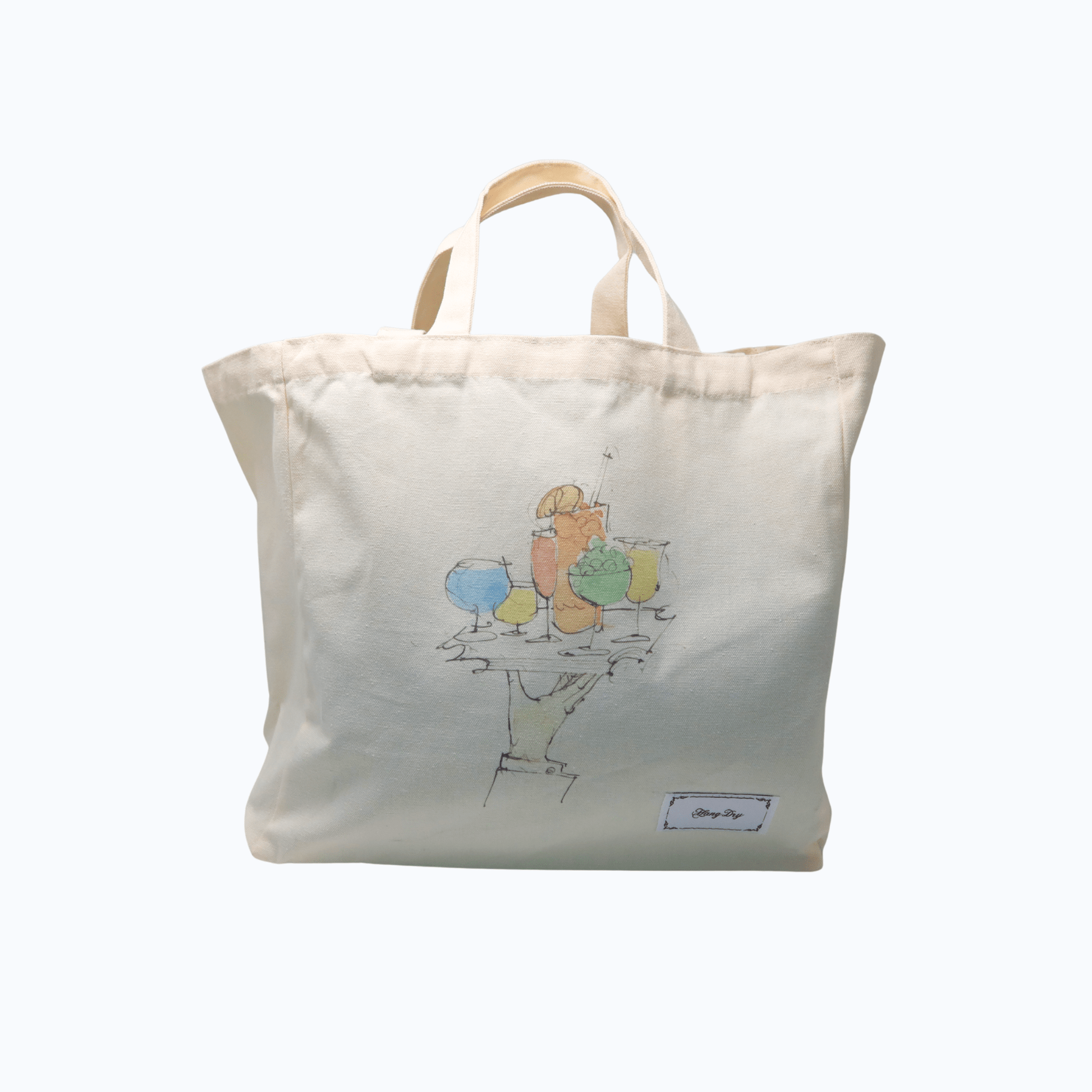 Hang Dry Sunday Dinner tote bag — white 100% cotton canvas with artwork and brand tag, showing dual strap lengths